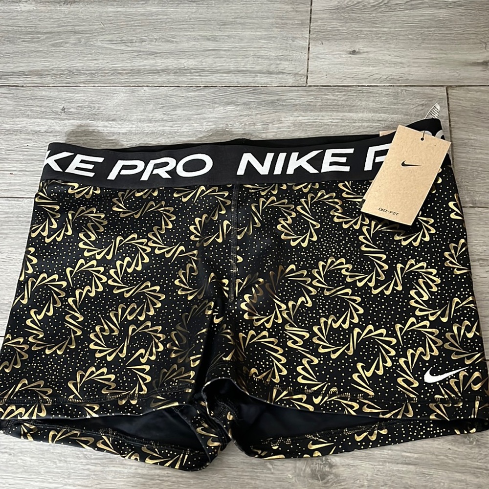 Nike Women's Black and Gold Patterned Shorts